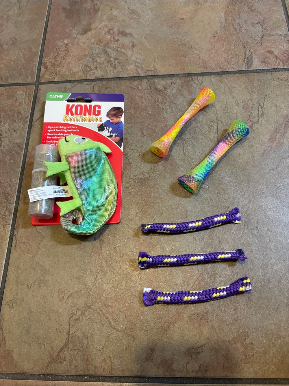 One catnip KONG refillables; Along with various cat toys. See pictures.